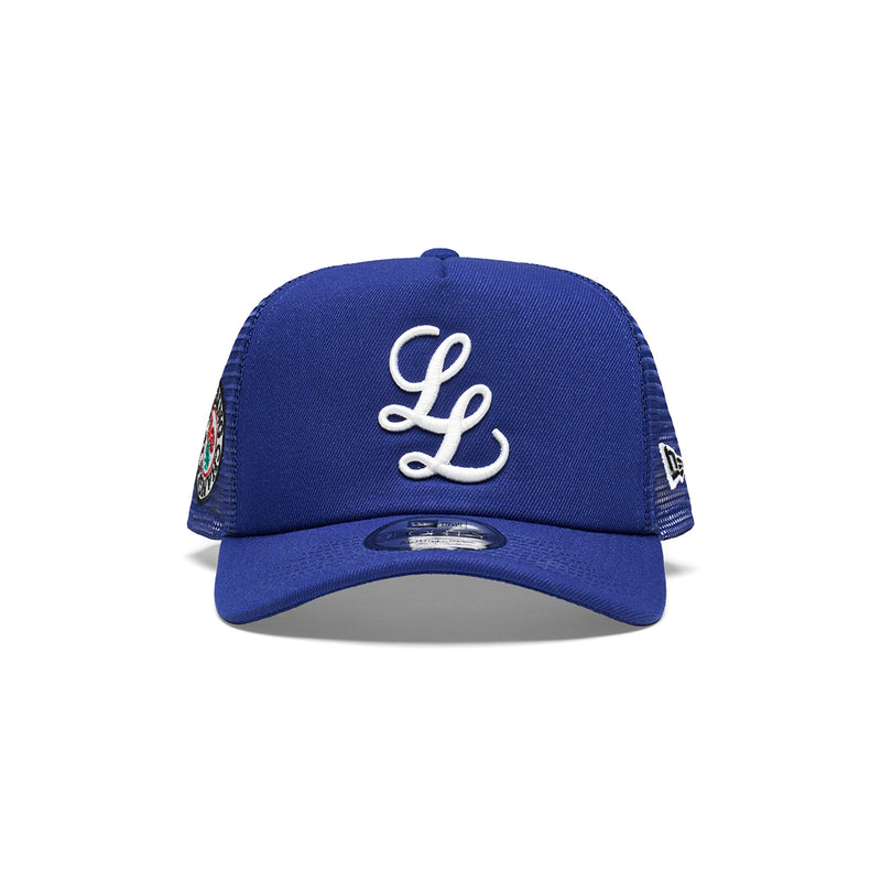 "NOTHING CHANGES" NEW ERA 9FORTY TRUCKER CAP [ROYAL BLUE]